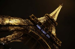 Lights on the Eiffel Tower read, "Paris Climat 2015" to mark the selection of the French capital to host the United Nations Climate Change Conference in 2015