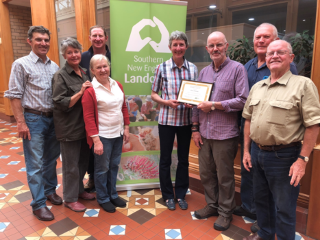Chris Duncan accepts the John Winter-Irving Bequest Certificate from David Henderson and the board of Southern New England Landcare. 